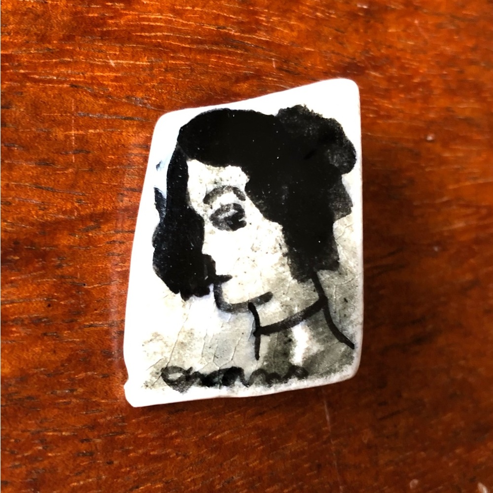 Woman’s Profile in Black Ink, Brooch Pin, signed at bottom by Artist.